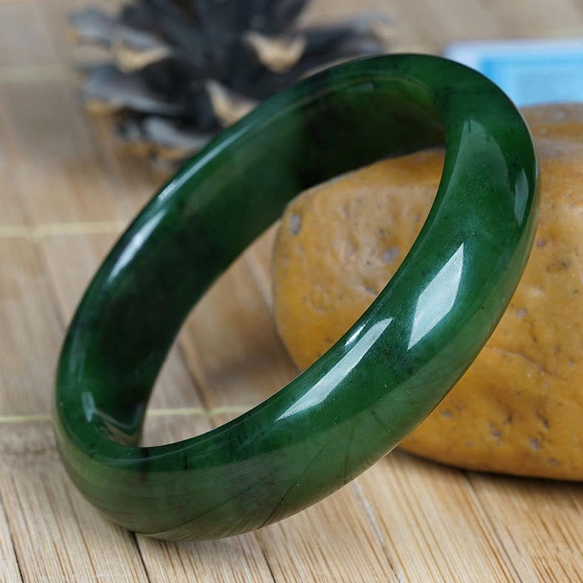 Hetian green jade bangle bracelet natural veining polished surface lifestyle