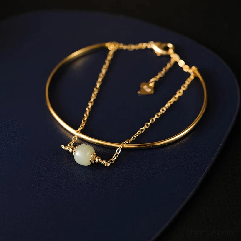 Hetian jade bangle bracelet one bead style with single light green jade bead and gold plated construction