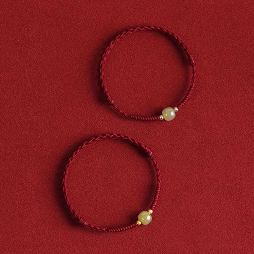 Two sizes Hetian jade red cord bracelets and anklets comparison red background