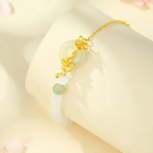Close-up side view of jade peace bracelet showing adjustable sterling silver chain and hetian jade beads with peace buckle design