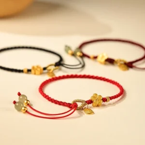 Collection of assorted hetian jade luck bracelets with various colors including red black and dark red braided cord strings