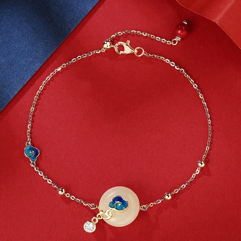 Sterling silver Hetian jade bracelet with satellite chain showing round jade peace buckle and blue cloud charm with CZ pendant