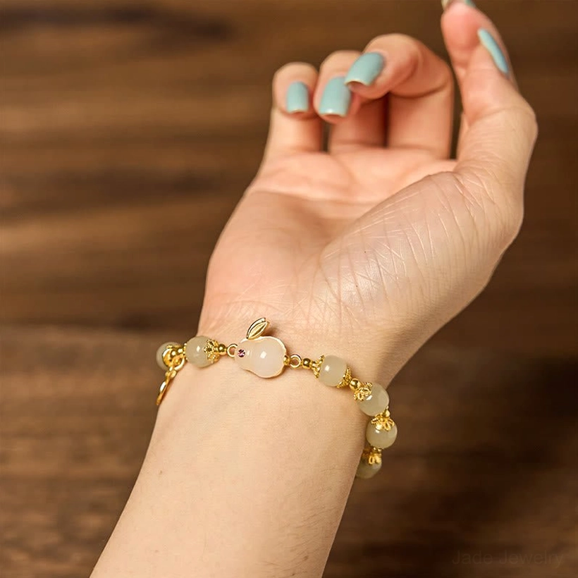 Wearing hetian jade bracelet on hand demonstrating elegant fit and sophisticated appearance
