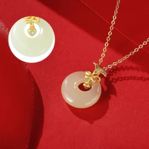 Complete hetian jade carnation necklace with sterling silver chain and adjustable extender on red fabric