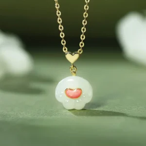 Hetian jade cat paw pendant necklace front close-up with white jade and pink enamel heart, 925 sterling silver chain