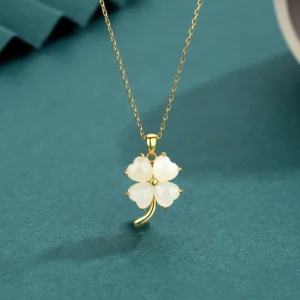 Hetian jade four leaf clover pendant necklace with gold-tone 925 sterling silver chain - overhead front view