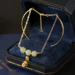 Hetian jade double layer gold bangle bracelet with three light green jade beads in luxury velvet jewelry box