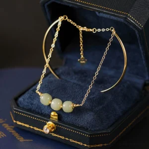 Hetian jade double layer gold bangle bracelet with three light green jade beads in luxury velvet jewelry box
