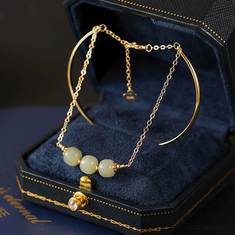 Hetian jade double layer gold bangle bracelet with three light green jade beads in luxury velvet jewelry box