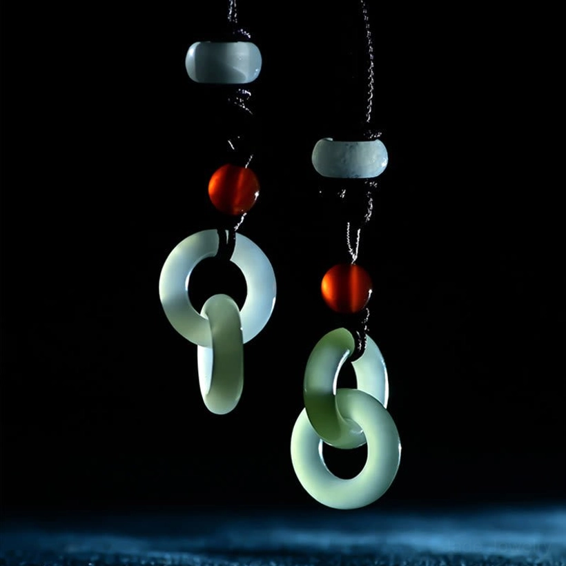 Front display view of cyan and white jade double peace buckle pendants with beaded cords and light blue spacers