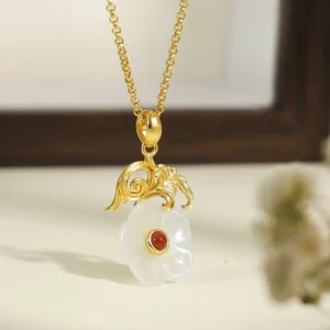 Hetian jade flower pendant with 925 sterling silver ornate scroll bail, white jade with red center stone, front flat lay view