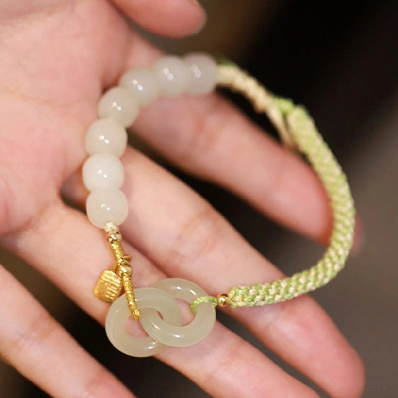 Hetian jade peace buckle bracelet fu charm engraving detail close-up