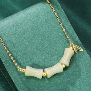 Hetian jade bamboo beads necklace with gold spacer beads side view close-up