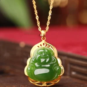 Hetian jade laughing Buddha pendant necklace with 925 sterling silver and 18K gold frame, overhead view on red velvet
