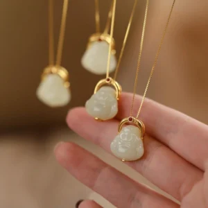 Hetian jade laughing Buddha pendant necklace overhead view with thin gold chain and polished white jade Buddha charm