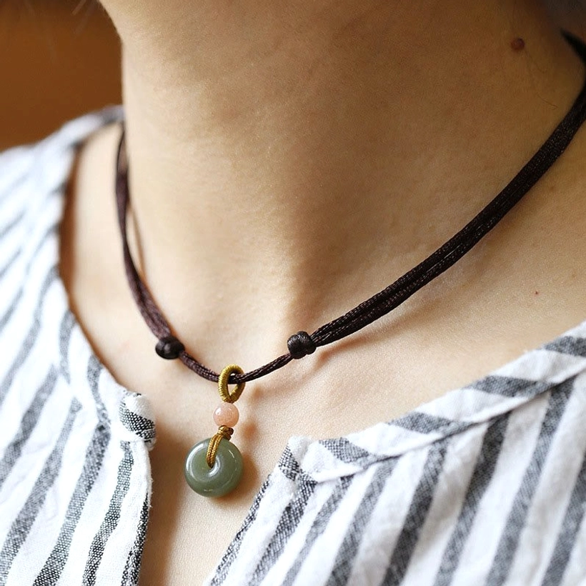 Natural hetian jade peace buckle pendant in brown wax cord, product showcase
