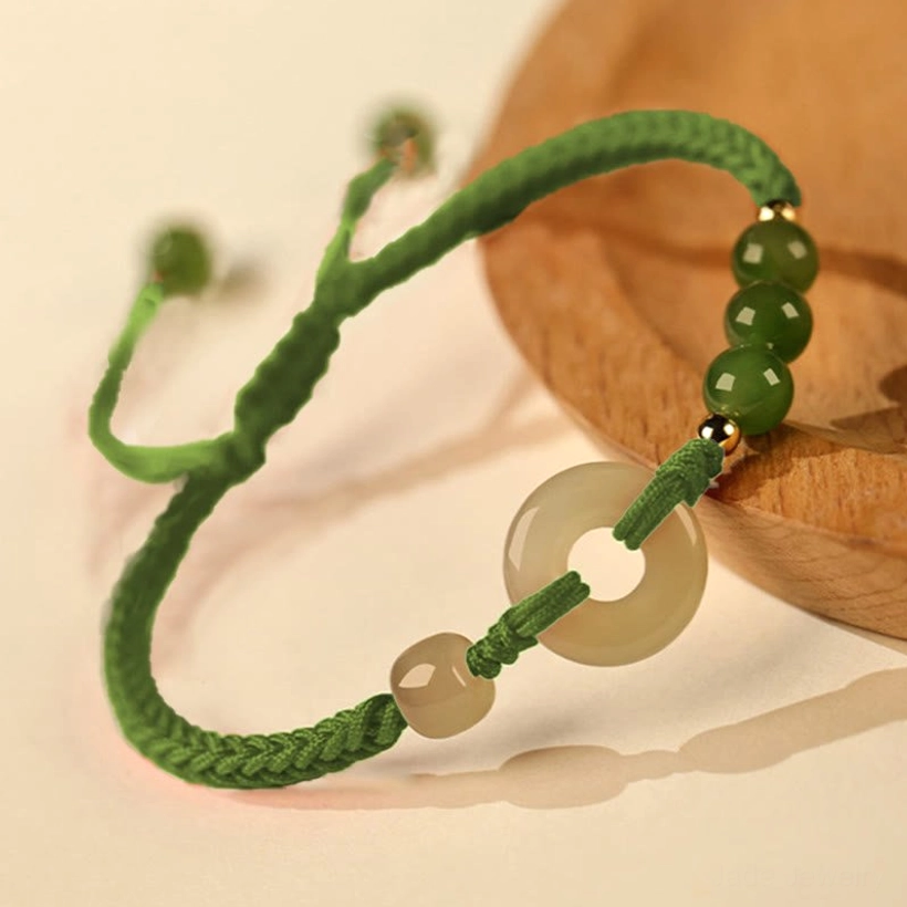 Green rope Hetian jade peace buckle bracelet variant showing earthy rope color with nephrite jade