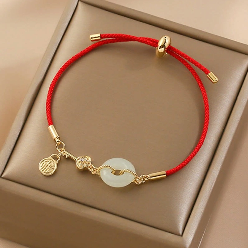 White jade peace buckle bracelet highlighting the circular talisman symbol and protective meaning