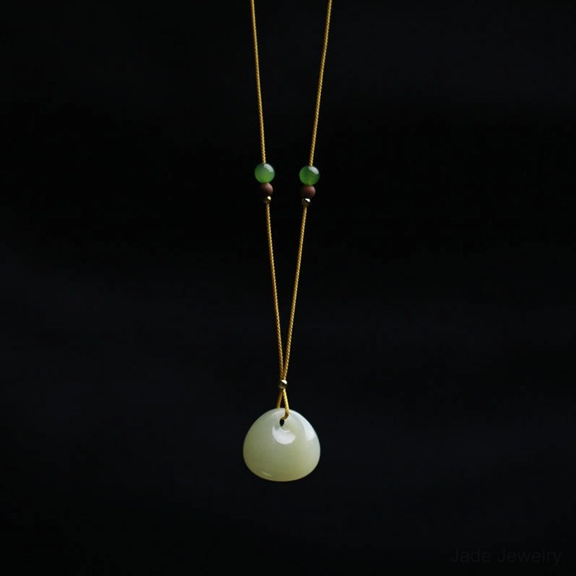 Hetian jade pendant necklace size comparison, small and large options side by side showing prosperity charm variations