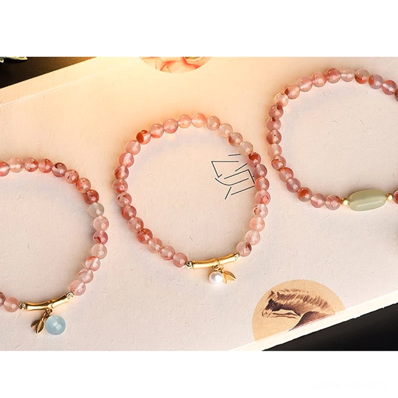 Hetian Jade smooth pebbles promotional card featuring prosperity, abundance and luck benefits