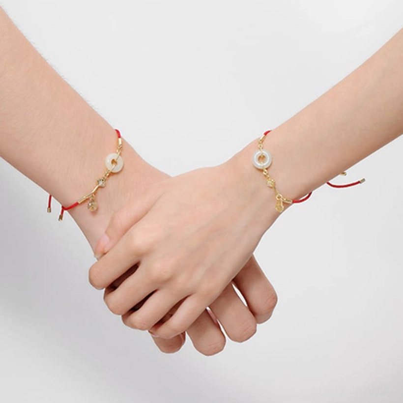 Jade peace bracelet with protective red string tradition rooted in Buddhist and Chinese heritage