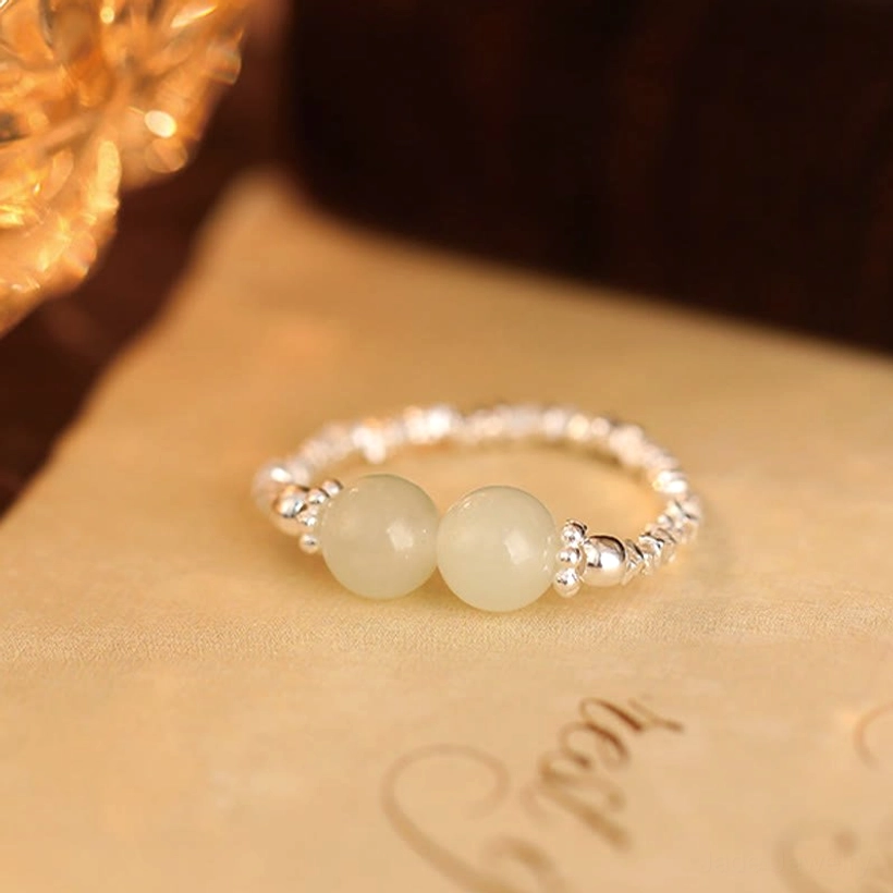 Hetian jade elastic ring variant comparison showing stone and silver detail work