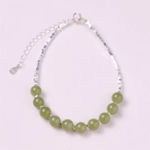 Hetian jade sterling silver prosperity bracelet full overhead view light green jade beads with 925 silver adjustable chain