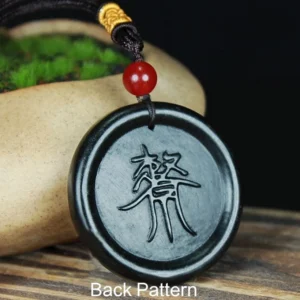 Back of Taoist jade pendant showing engraved divine decree talisman script and matching braided necklace cord