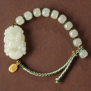 Chinese zodiac Hetian jade bracelet with 925 sterling silver fu charm - overhead flat lay view