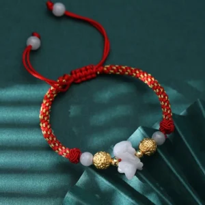 Adjustable horse zodiac jade bracelet with woven red cord, detailed side view showing charm and bead composition