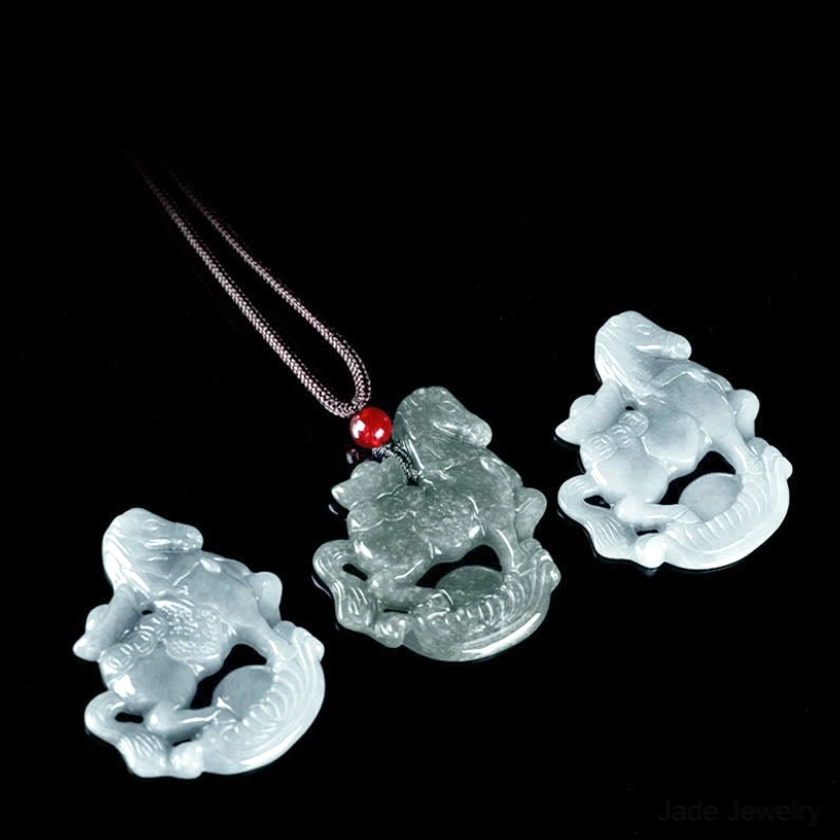 Extreme close-up detail of carved horse ingot jade pendant showing fine artisan craftsmanship, surface detailing, carving precision, and natural jade stone characteristics