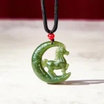 Chinese zodiac horse jade pendant necklace with dark green carved horse design and red accent bead on black cord