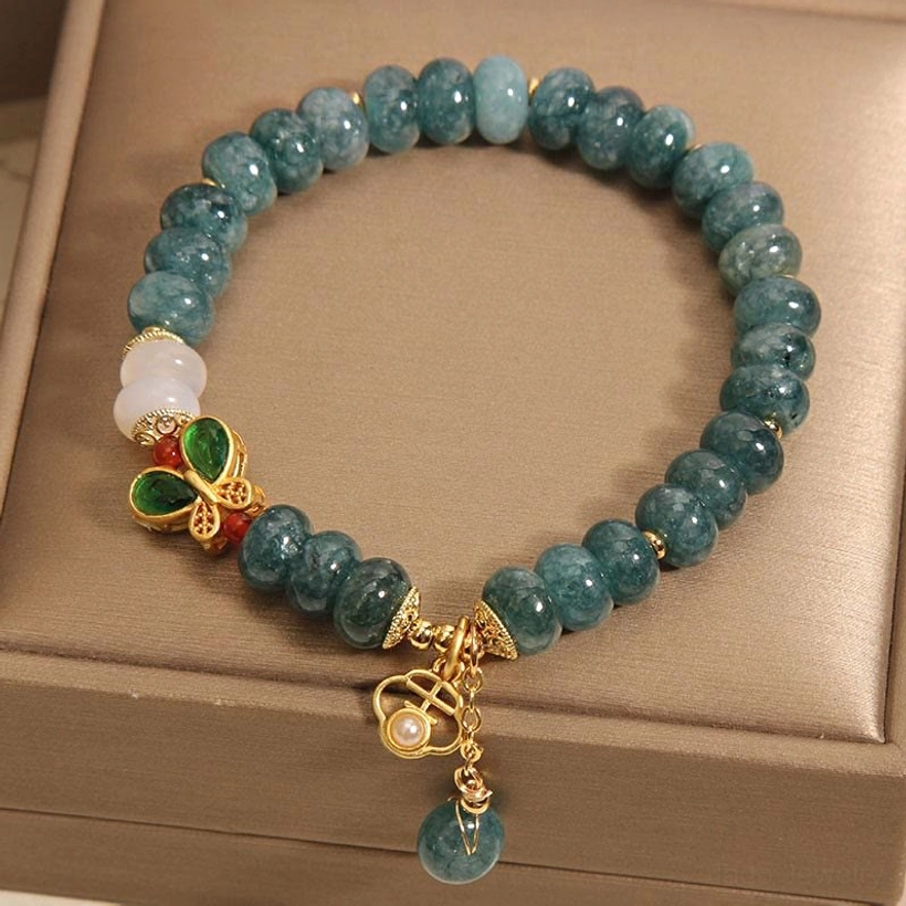 Jade abacus bracelet with extended chain and teal jade drop pendant displayed in brown jewelry box, front overhead view