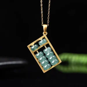 Gold-tone natural jade abacus necklace pendant with blue-green jade beads in traditional abacus pattern, front view on dark background