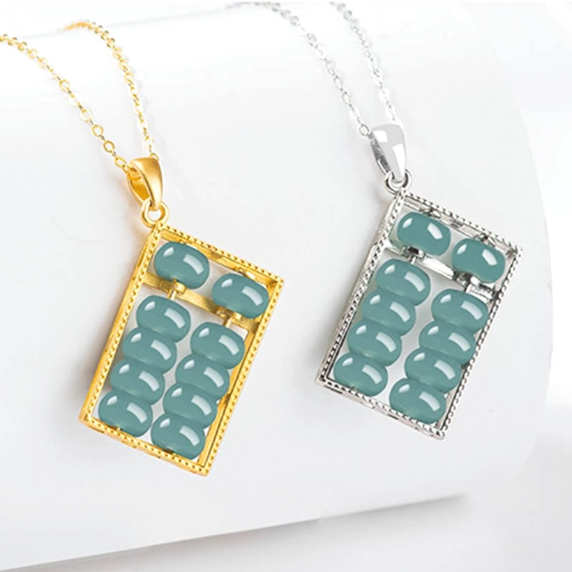 Two natural jade abacus necklaces with polished blue-green jade beads, close-up flat lay showing metal frame details