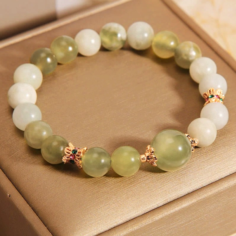 Natural jade prosperity bracelet flat lay styling with feng shui elements