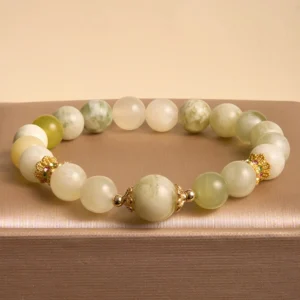 Marbled green and cream jade prosperity bracelet with gold hardware accents