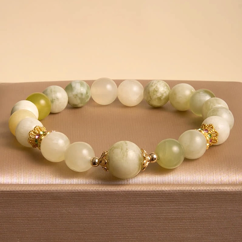 Marbled green and cream jade prosperity bracelet with gold hardware accents