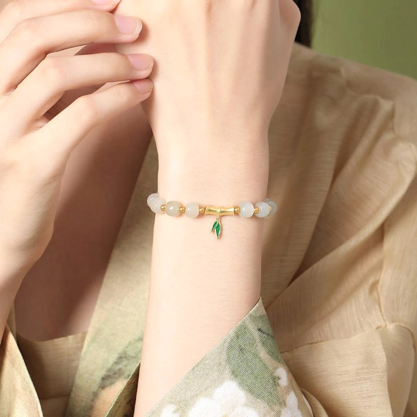 Worn Hetian jade bracelet on wrist close-up showing fit and comfort on model