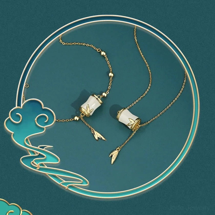 Hetian jade bamboo jewelry collection flat lay with white jade necklace and bracelet pieces artfully arranged with decorative oriental cloud motif ornament, showcasing cultural heritage aesthetic