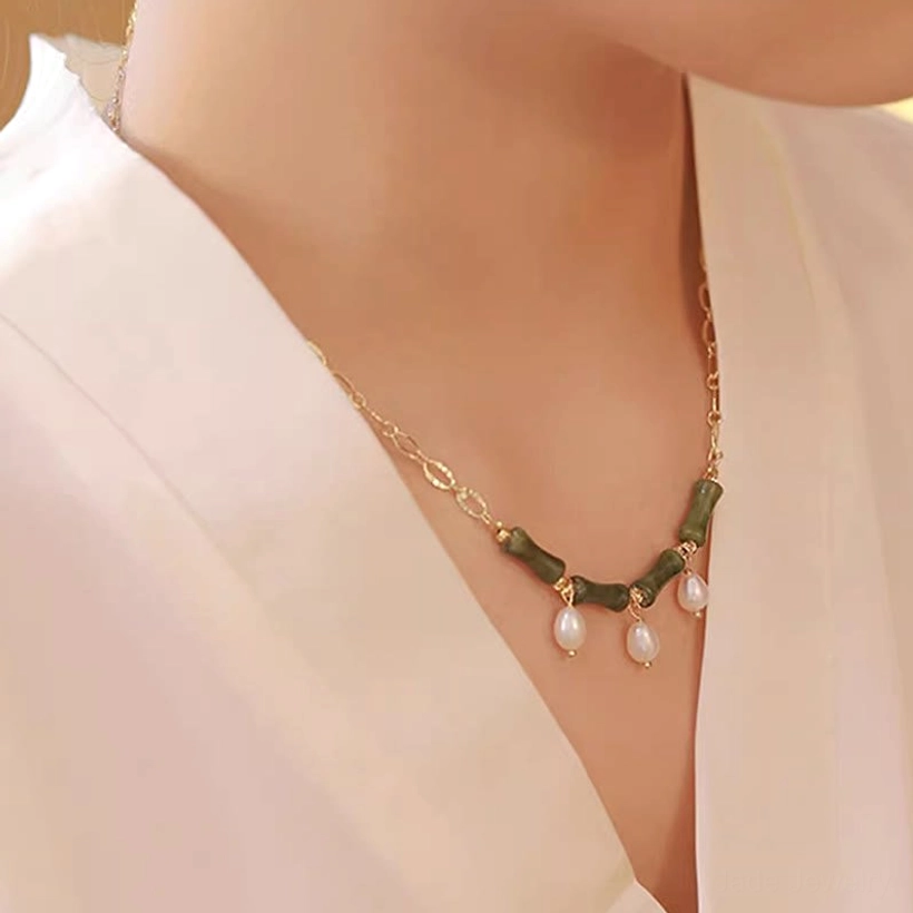 Side view of Tianshan jade bamboo pearl necklace worn on model showing elegant drape