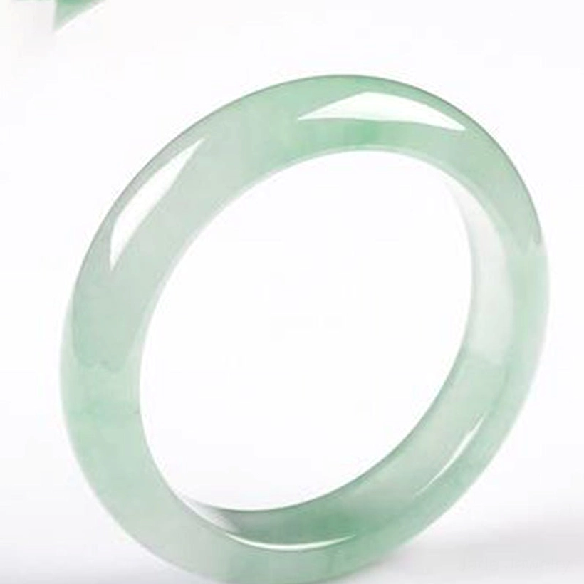 Jade bangle bracelet minimalist display on white background showcasing polished light green jade quality