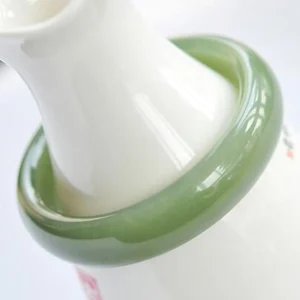 Olive green jade bangle bracelet side close-up showing high-gloss polished surface