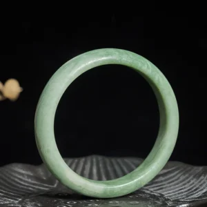Light celadon jade bangle bracelet polished smooth finish side view