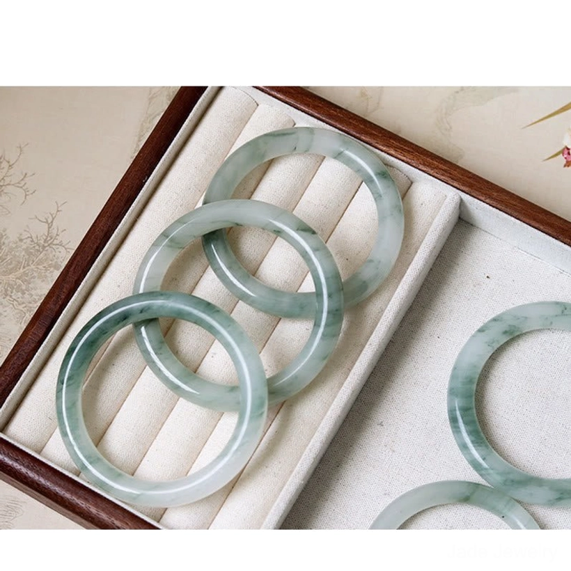 Jade bangle bracelet size guide and measurement chart showing inner diameters 52mm 54mm 56mm 58mm for proper fit selection