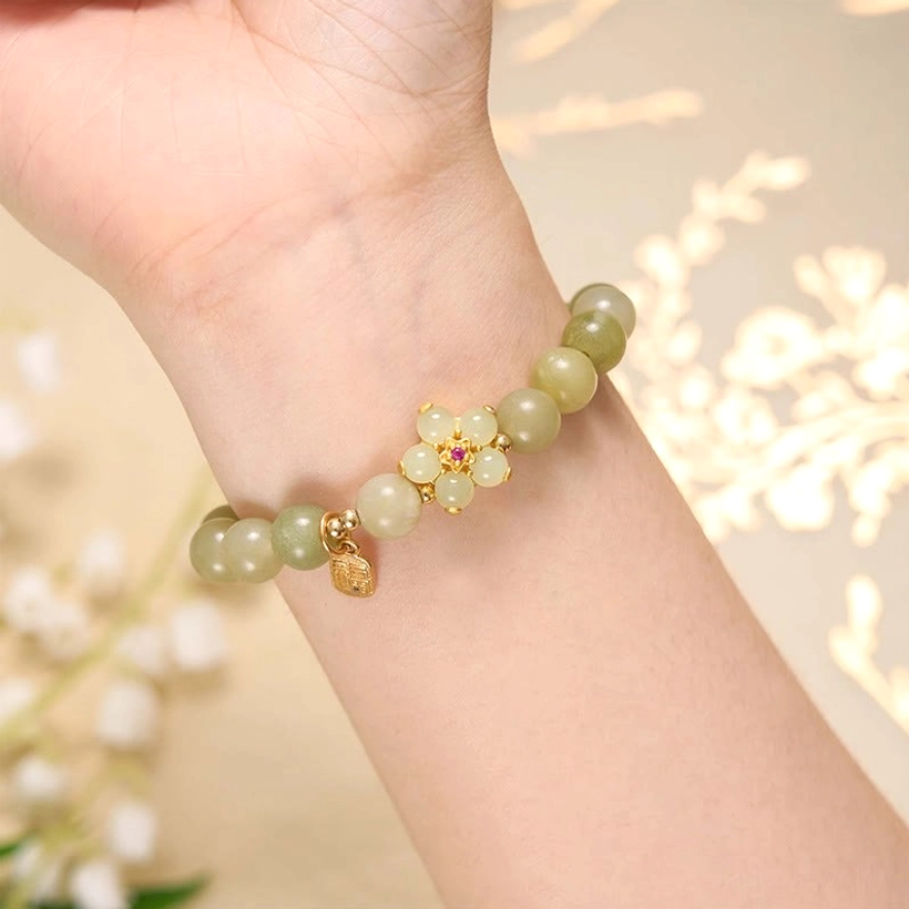 Jade bracelet with Fu pendant style variation showing different bead arrangement and charm placement for prosperity and good fortune