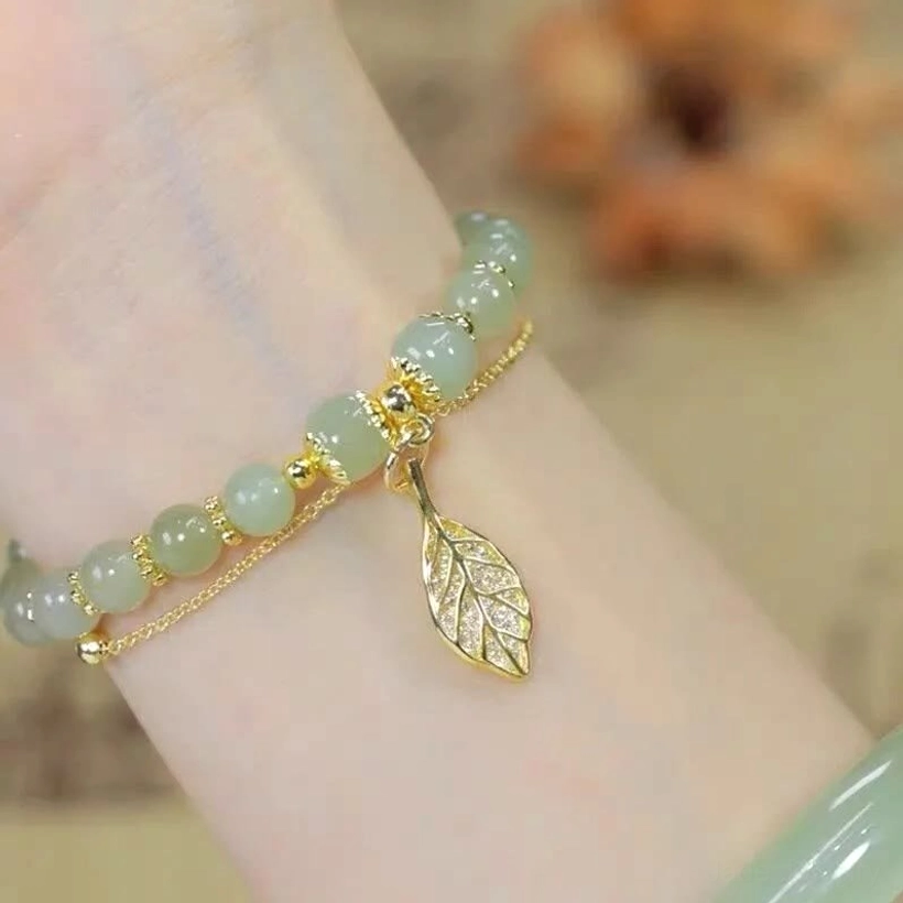 Gold-plated jade charm bracelet investment piece for wealth and business success