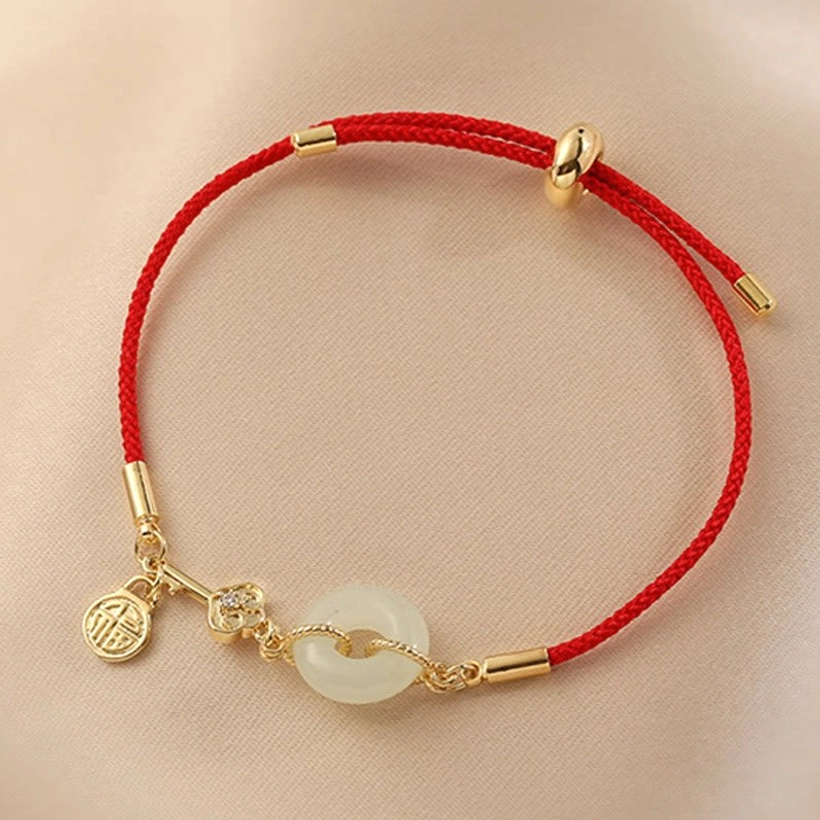 Handcrafted red cord jade bracelet detail showing artisan craftsmanship and master craftsman quality
