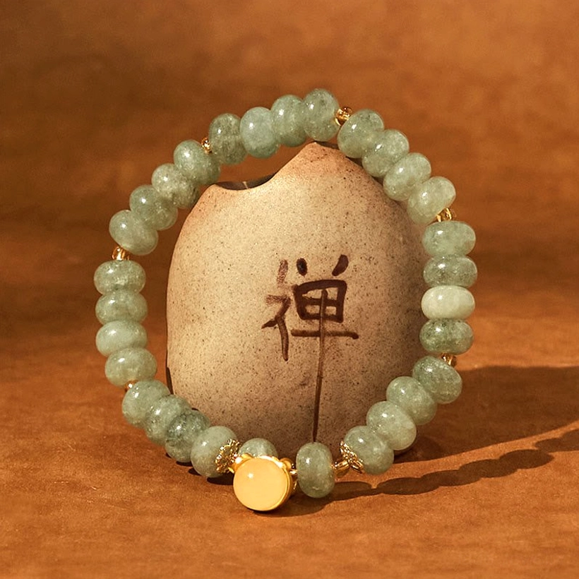 Jade Bracelet with Lucky Cat Charm Flat Lay - Artisan Crafted Details