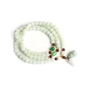 Multi-strand light jade beaded bracelet with gourd and leaf jade pendants on white background studio shot